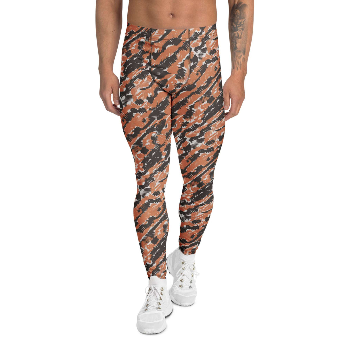 A person modeling high-waisted leggings with an orange, black, and gray tiger-stripe pattern, paired with white sneakers, shown against a plain white background. Unique Bold Artistic Brush Stroke Pattern Men's Athletic Leggings