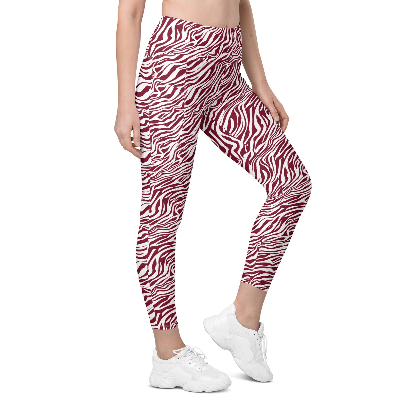 A model wearing high-waisted leggings with a red and white zebra print pattern, paired with white sneakers, shown against a plain white background. Unique Bold Red Zebra Print Leggings with Pockets