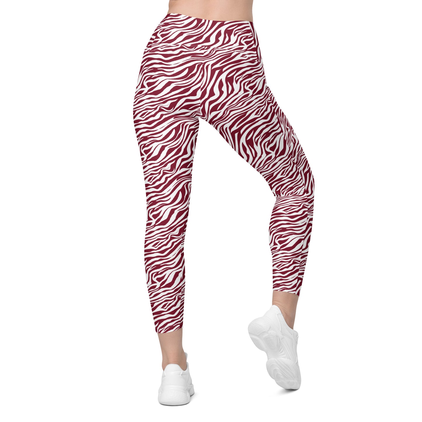 Red and white zebra print leggings shown on a model from the waist down, paired with white sneakers against a plain white background. Unique Comfortable Bold Red Zebra Print Leggings with Pockets for Activewear