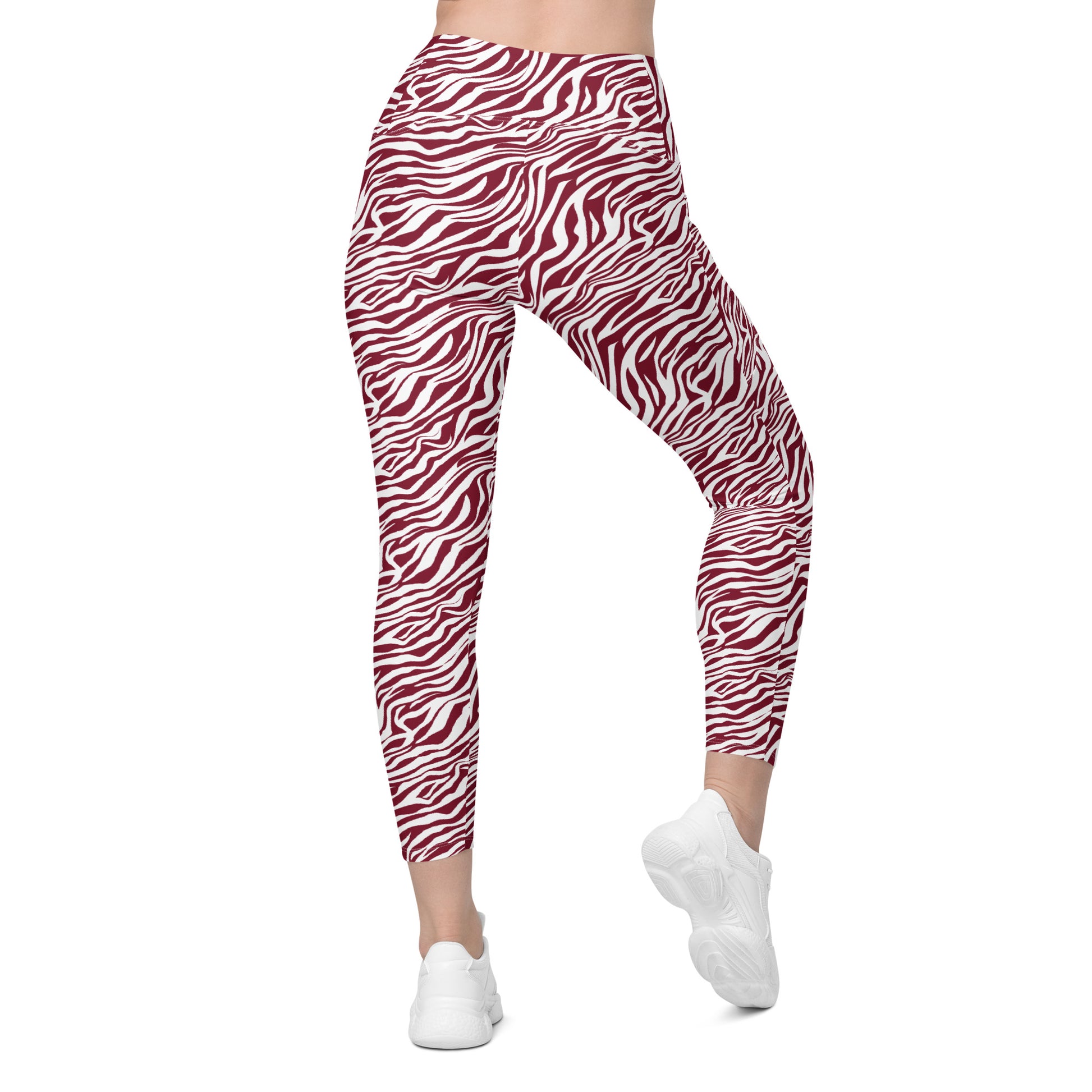 Red and white zebra print leggings shown on a model from the waist down, paired with white sneakers against a plain white background. Unique Comfortable Bold Red Zebra Print Leggings with Pockets for Activewear