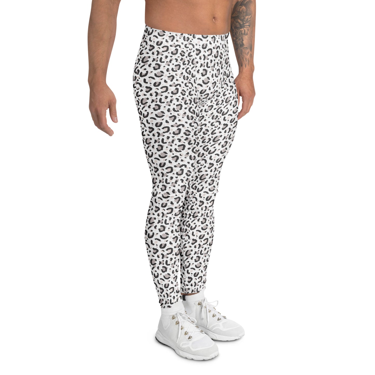 A model wearing high-waisted, ankle-length athletic leggings with a black and white leopard print pattern, paired with white sneakers, shown against a plain white background. Unique Minimalist Bold Leopard Print Men's Leggings Activewear