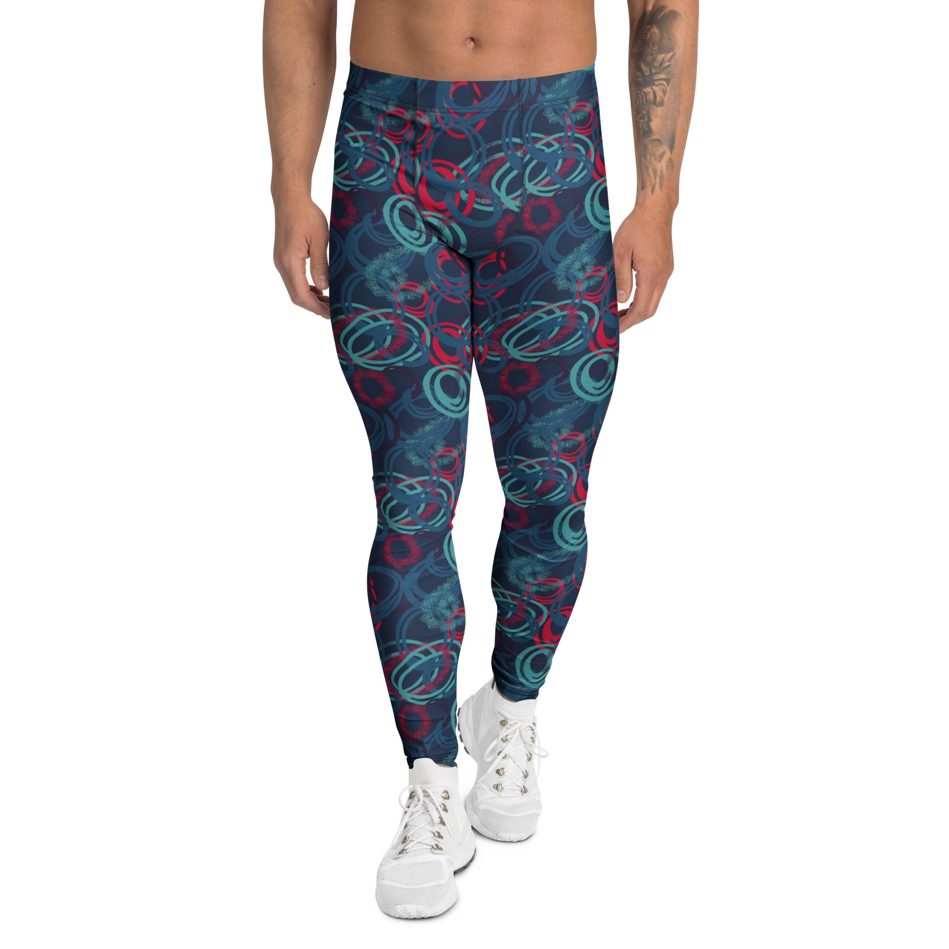 A person modeling high-waisted leggings with an abstract swirl pattern in navy blue, teal, and red, paired with white sneakers against a plain white background. Vibrant Geometric Shapes Men's Athletic Leggings Activewear