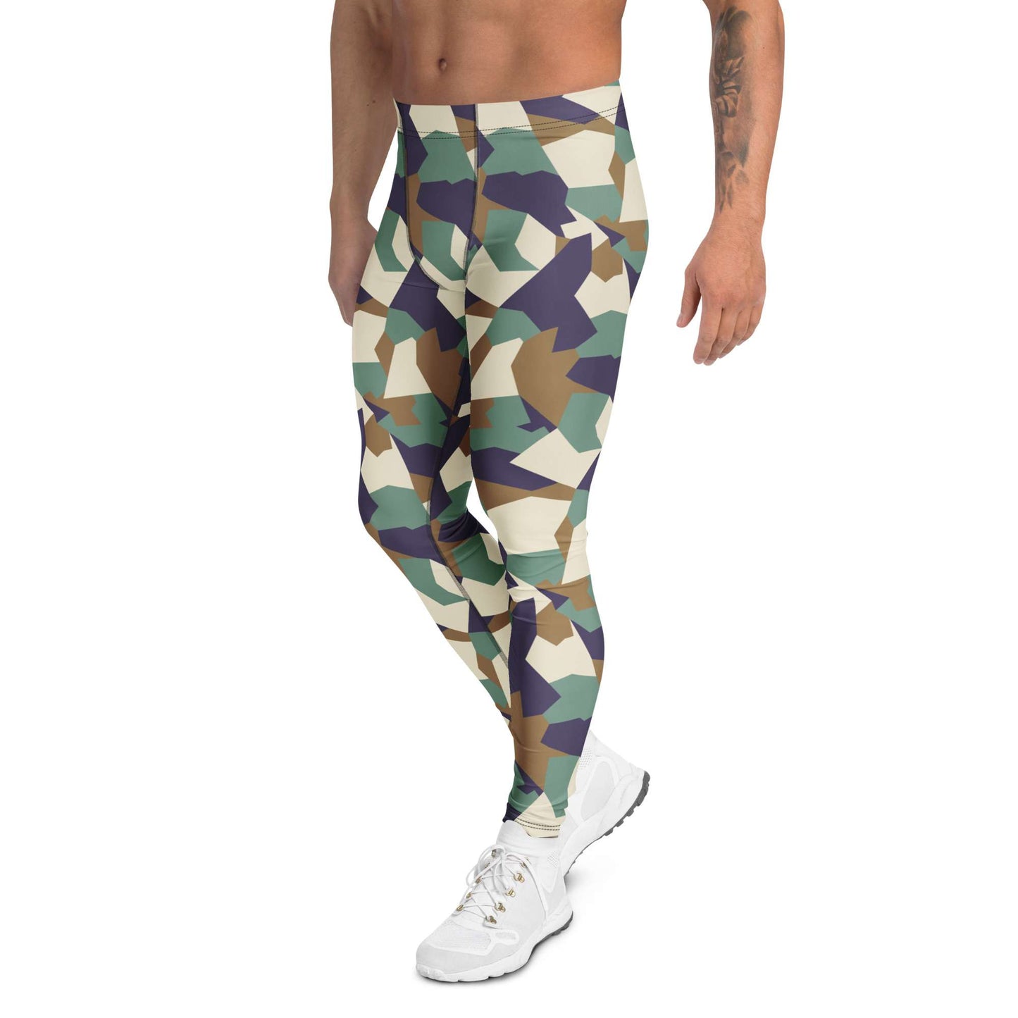 A man wearing geometric camouflage athletic leggings in shades of green, beige, brown, and purple, paired with white sneakers, shown from the waist down on a white background. Bold Colorful Camouflage Geometric Men's Leggings Activewear Shop Bold Colorful Camouflage Geometric Men's Leggings with a standout print, flexible fit, and all-day comfort for workouts or streetwear.
