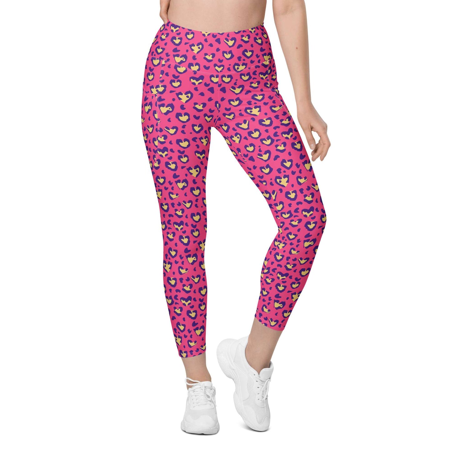 A model wearing bright pink leggings with a colorful heart pattern, paired with white sneakers, shown from the waist down on a plain white background. Heart Pink Leopard Pattern Leggings with Pockets Activewear Shop Heart Pink Leopard Pattern Leggings with Pockets Activewear, designed for bold workouts, everyday comfort, and convenient storage. Upgrade your workout wardrobe with Heart Pink Leopard Pattern Leggings with Pockets Activewear—stylish, practical, and made to move.