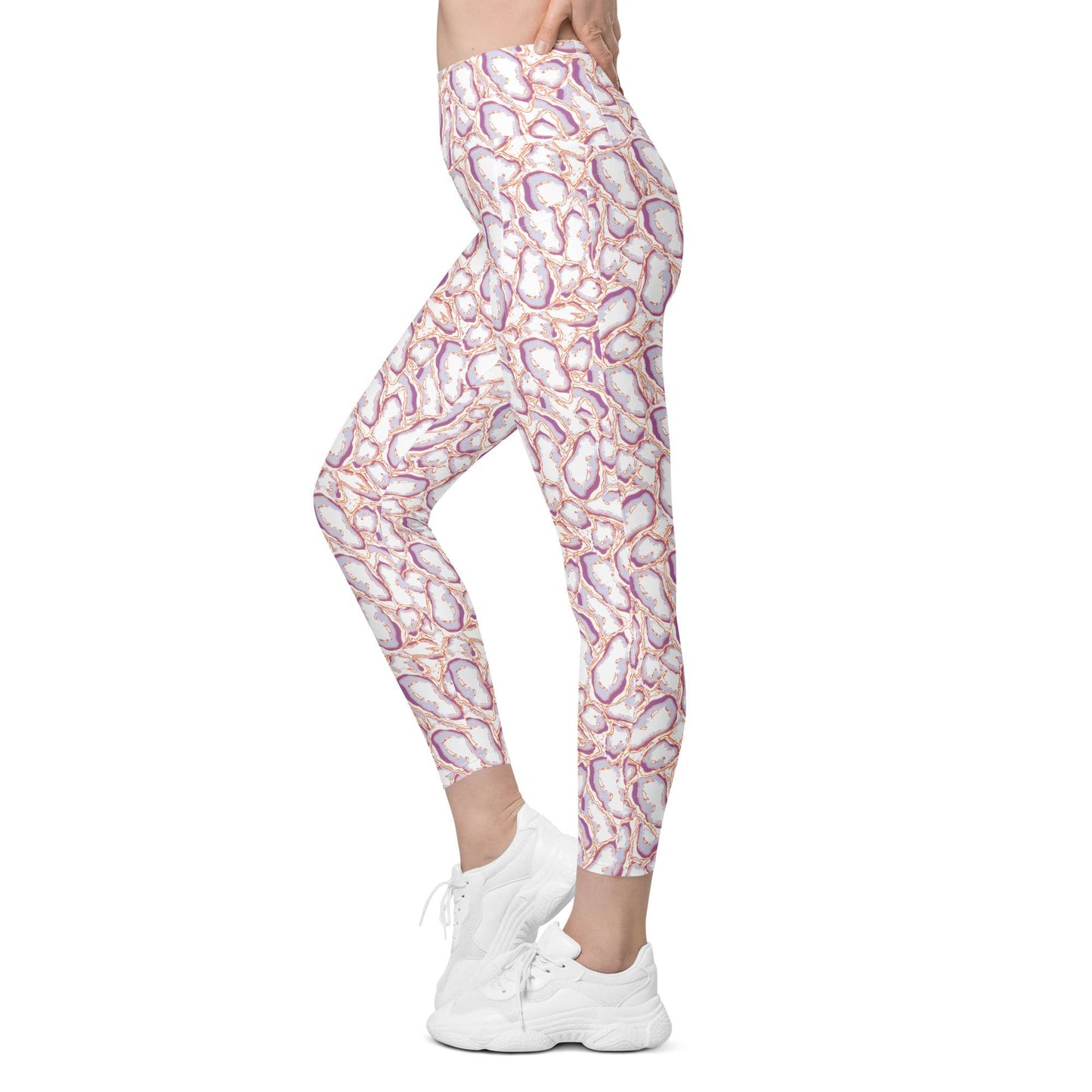 A person modeling high-waisted leggings with an abstract paisley-like pattern in white, pink, purple, and orange, paired with white sneakers on a plain white background. Elegant Organic Marble Stone Leggings with Pockets Activewear Shop Elegant Organic Marble Stone Leggings with Pockets, designed for all-day comfort, flexible movement, and standout style. Elevate your activewear with Elegant Organic Marble Stone Leggings with Pockets, blending bold marble style, comfort, and function.