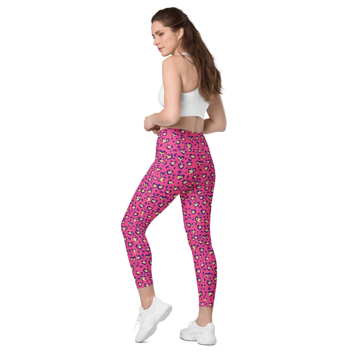 Woman wearing purple leggings with a logo on a white background Heart Pink Leopard Pattern Leggings with Pockets Activewear Shop Heart Pink Leopard Pattern Leggings with Pockets Activewear, designed for bold workouts, everyday comfort, and convenient storage. Upgrade your workout wardrobe with Heart Pink Leopard Pattern Leggings with Pockets Activewear—stylish, practical, and made to move.